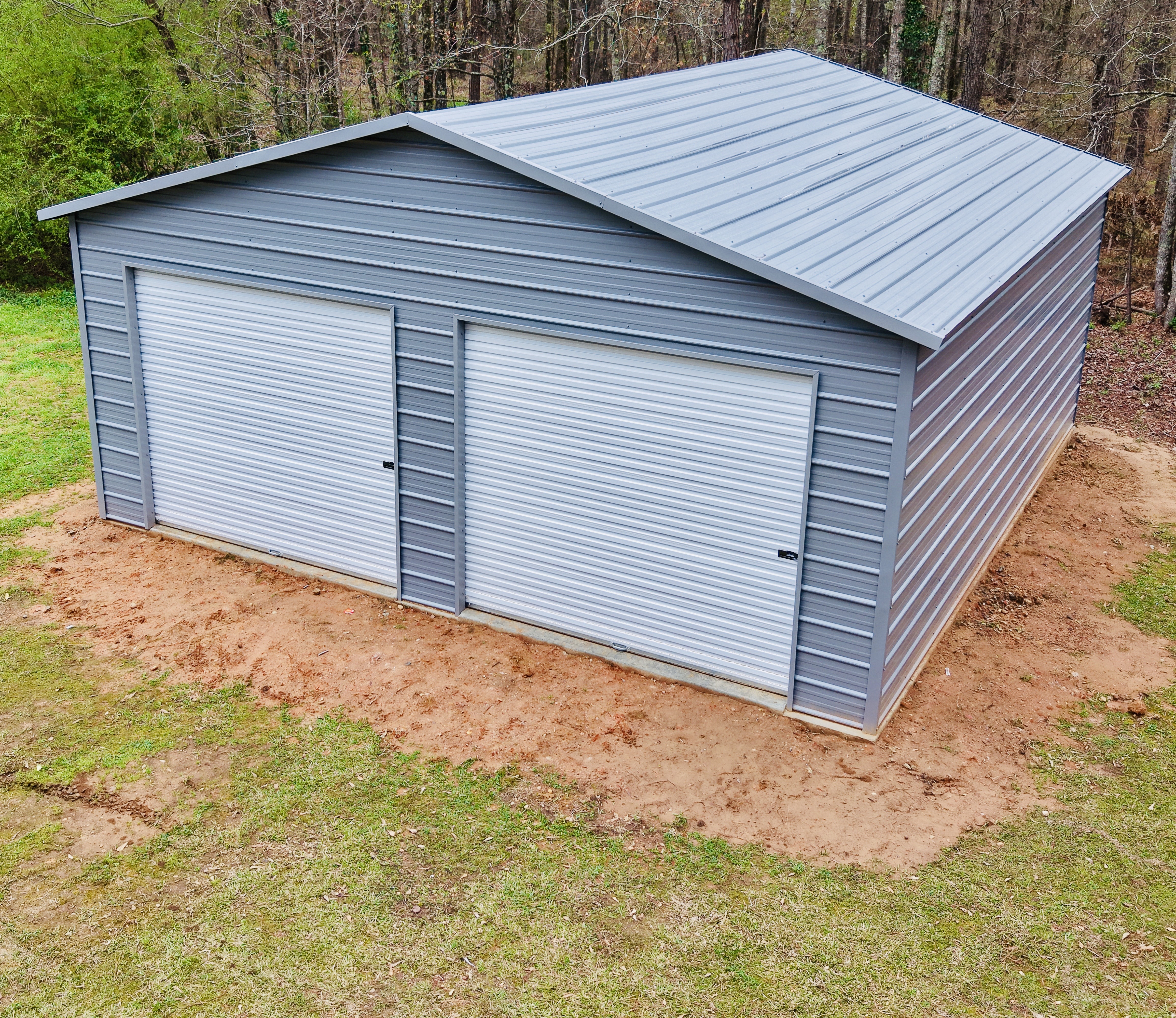 24x25 metal shop with dual roll up doors by Turner Structures